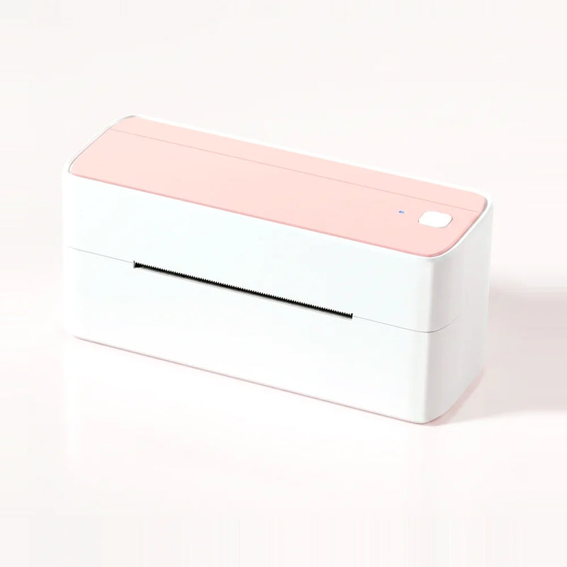 Imprimante d'étiquettes d'expédition blanche à capot rose, vue de trois quarts sur fond rose pâle