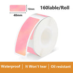 Rouleau d'étiquettes en dégradé rose poudré vers le blanc, 160 étiquettes de 12 x 40 mm par rouleau