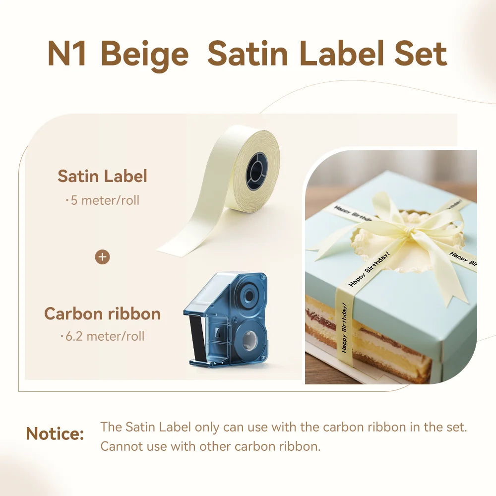 Coffret ruban satin beige de 5 m et cassette de ruban carbone, avec un cadeau noué d'un ruban Happy Birthday