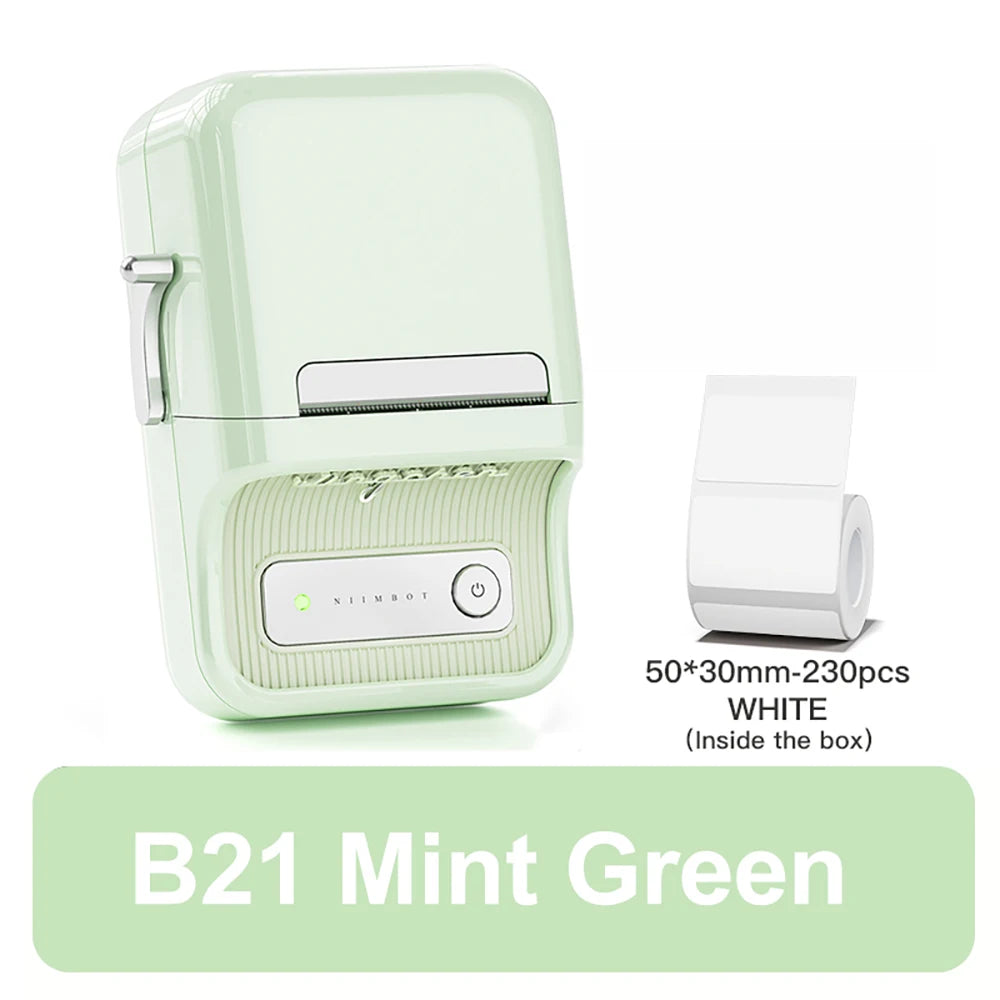 Imprimante vert menthe de trois quarts avec le rouleau blanc 50x30 mm de 230 étiquettes fourni dans la boîte