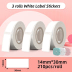 Trois rouleaux d'étiquettes blanches, format 14 x 30 mm, 210 pièces par rouleau, sur fond rose