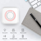Imprimante à anneau rose et six pictogrammes : impression ciblée, notes, recherche photo, Bluetooth, format compact et autonomie
