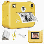 Appareil ourson jaune imprimant une photo d'enfants à une fête, avec rouleaux de papier, dragonne jaune, câble USB et vue de dos à l'écran allumé sur deux enfants