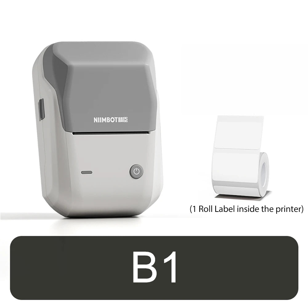 Imprimante compacte blanche à capot gris moyen, le rouleau d'étiquettes fourni posé à sa droite