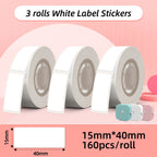 Trois rouleaux d'étiquettes blanches au format 15 x 40 mm, soit 160 pièces par rouleau