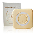 Mini imprimante thermique jaune pastel à anneau blanc, posée devant sa boîte blanche Portable Mini Printer