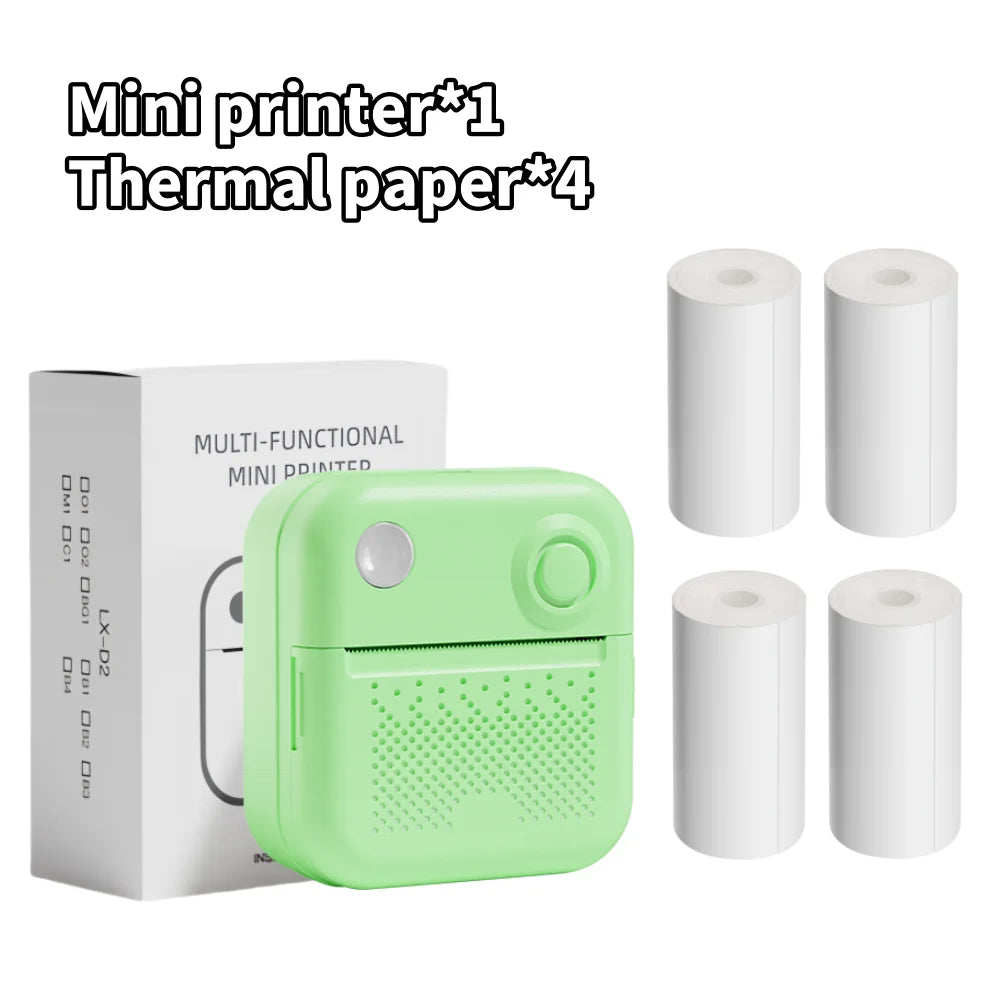 Imprimante vert pomme devant sa boîte, accompagnée de quatre rouleaux de papier thermique blanc