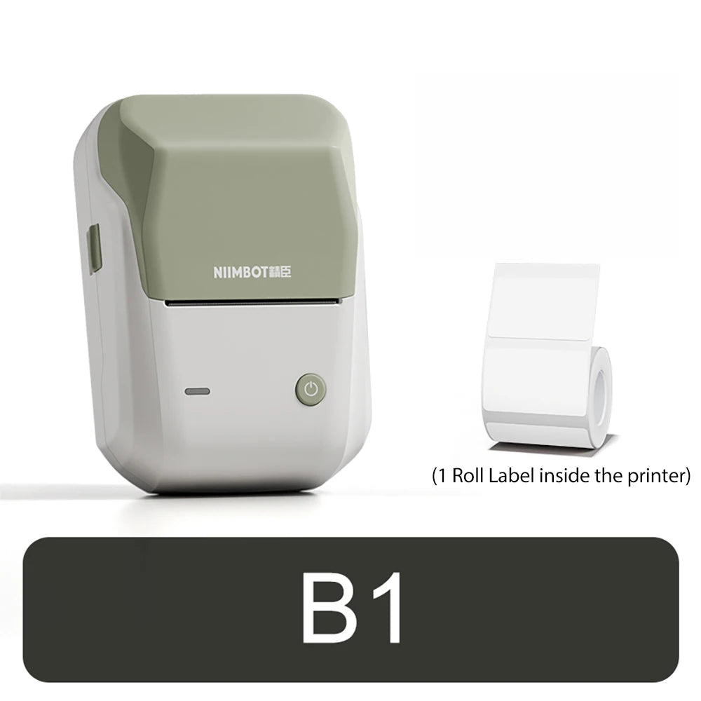 Imprimante compacte blanche à capot vert sauge, posée à côté du rouleau d'étiquettes fourni dans la machine
