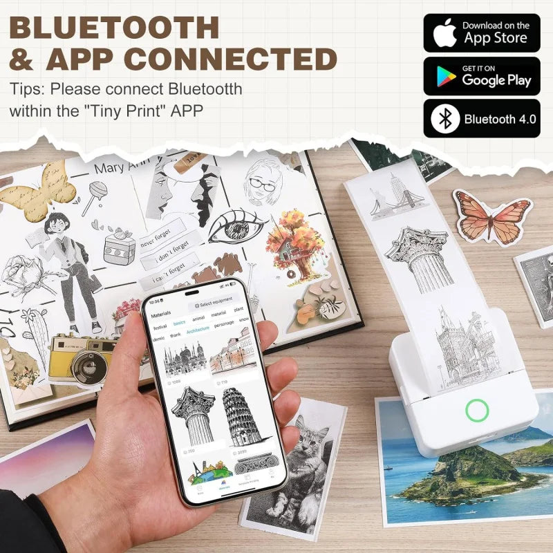 Main tenant un smartphone devant une imprimante blanche qui sort un sticker de monument, carnet de stickers autour