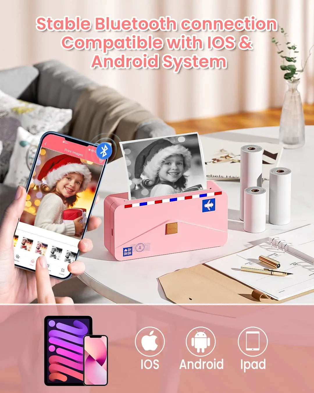 Imprimante rose reliée en Bluetooth à un smartphone, photos imprimées et logos iOS, Android et iPad