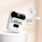 Imprimante thermique portable blanche avec exemples d'étiquettes colorées autocollantes